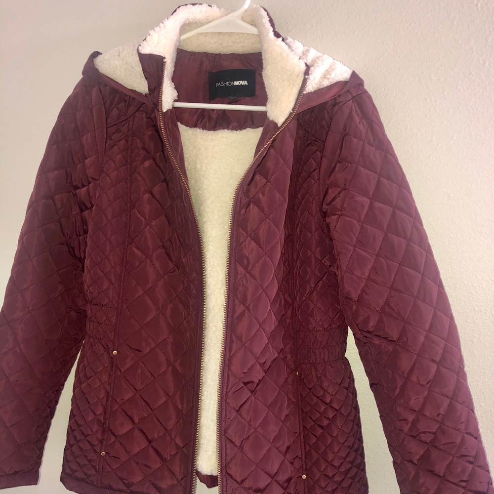 Maroon quilted jacket with fuzzy inside.